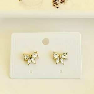 Aros pasantes moño dorado con piedras.