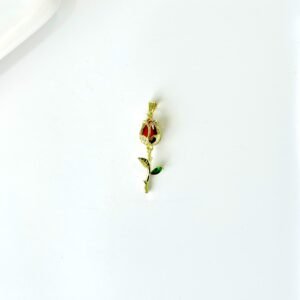 Dije de acero dorado, tulipán con piedras roja y verde.