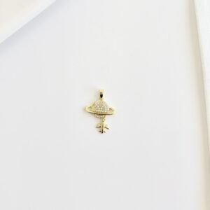 Dije dorado, planeta con strass.