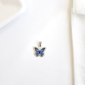 Dije de mariposa azul chico.