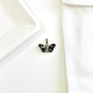 Dije de mariposa con murano.