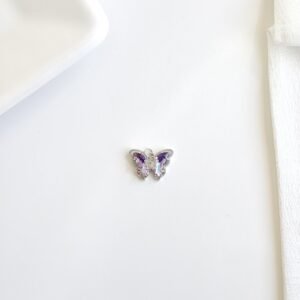 Dije dde mariposa con piedras.