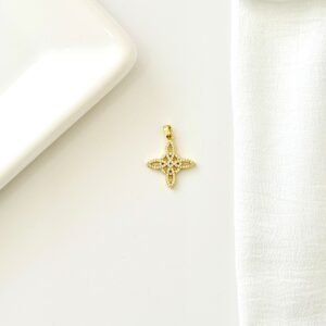 Dije nudo de bruja dorado con strass.