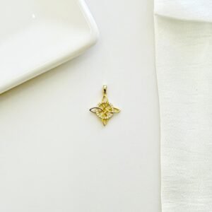 Dije nudo de bruja dorado con strass.