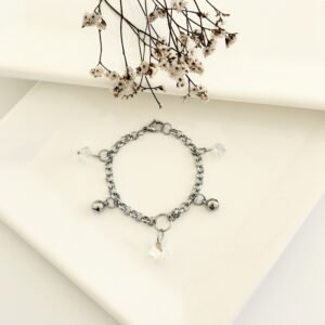 Pulsera acero con dijes cristal tornasol.