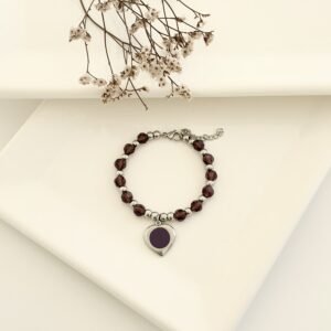 Pulsera acero con dije y piedras.