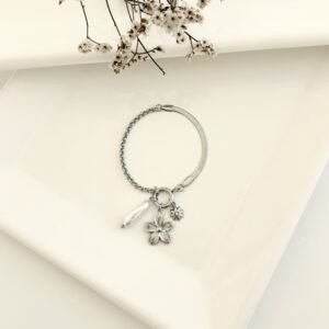 Pulsera acero con dije y perla.