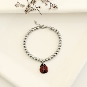 Pulsera acero con dije.