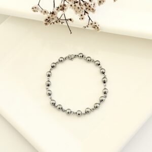 Pulsera acero, pelotitas.