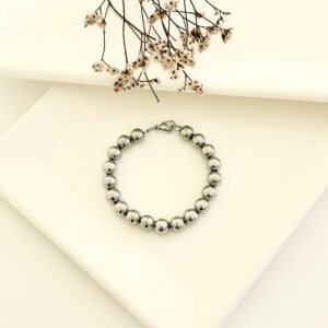Pulsera acero con pelotitas.