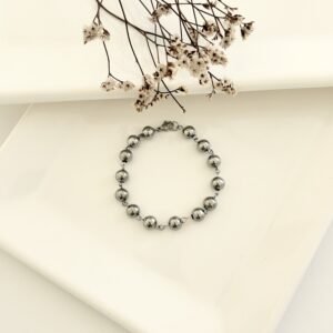 Pulsera acero con pelotitas.