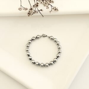 Pulsera acero con pelotitas. x 19cm.