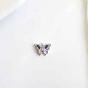 Dije dde mariposa con piedras.