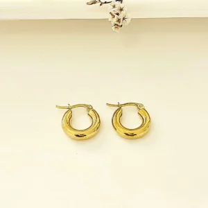 Aros de acero dorado redondos. 1 cm. de diámetro