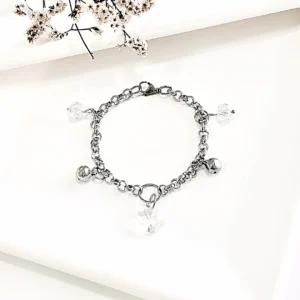 Pulsera de acero con dijes cristal tornasol.