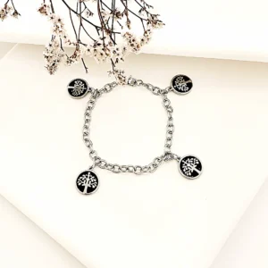Pulseras de acero con dijes árbol de la vida.