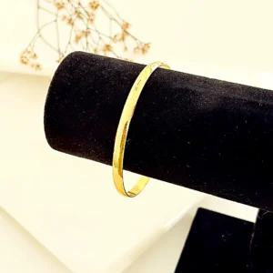 Pulsera esclava de acero dorado. 65 mm.