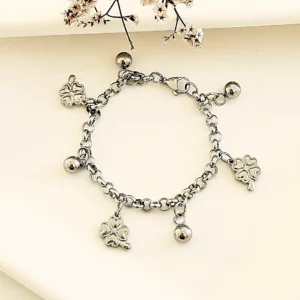 Pulsera acero con dijes.