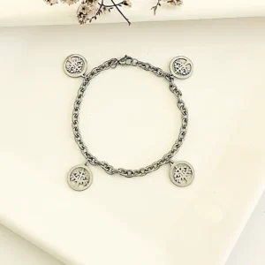 Pulsera de acero con dijes árbol de la vida.
