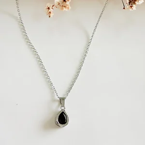 Conjunto de acero, con piedra negra. 40+5 cm.